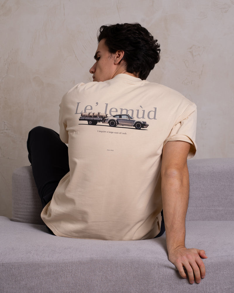 Back view of Lelemud Economist tee in cream featuring vintage car graphic and brand logo print