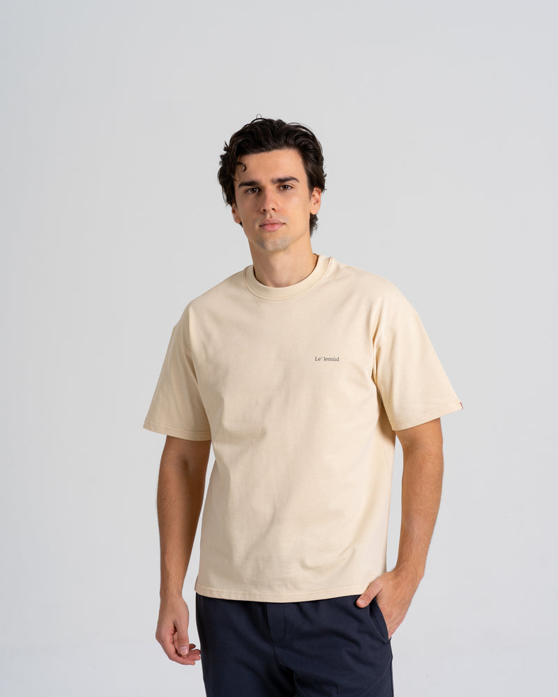 Lelemud Economist tee in cream beige colorway - men's premium t-shirt with minimalist embroidered logo