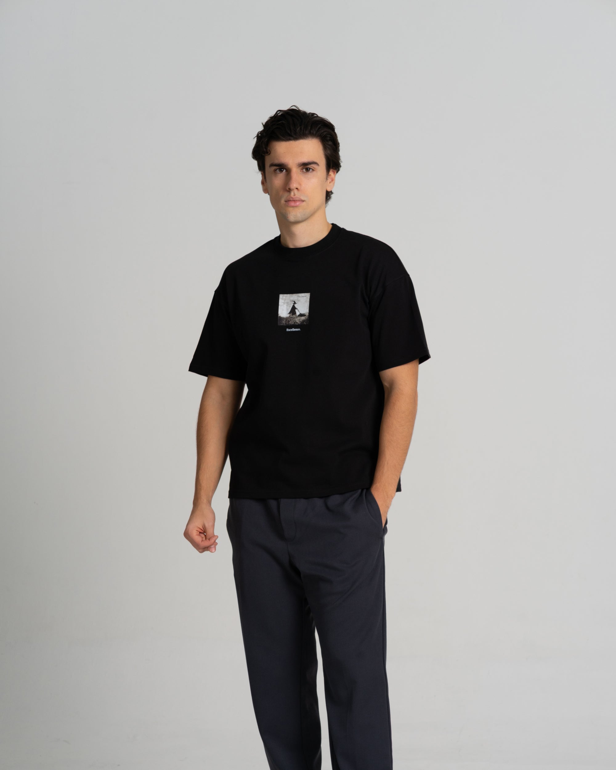 Lelemud Excellence tee in black premium cotton with chest graphic -front view