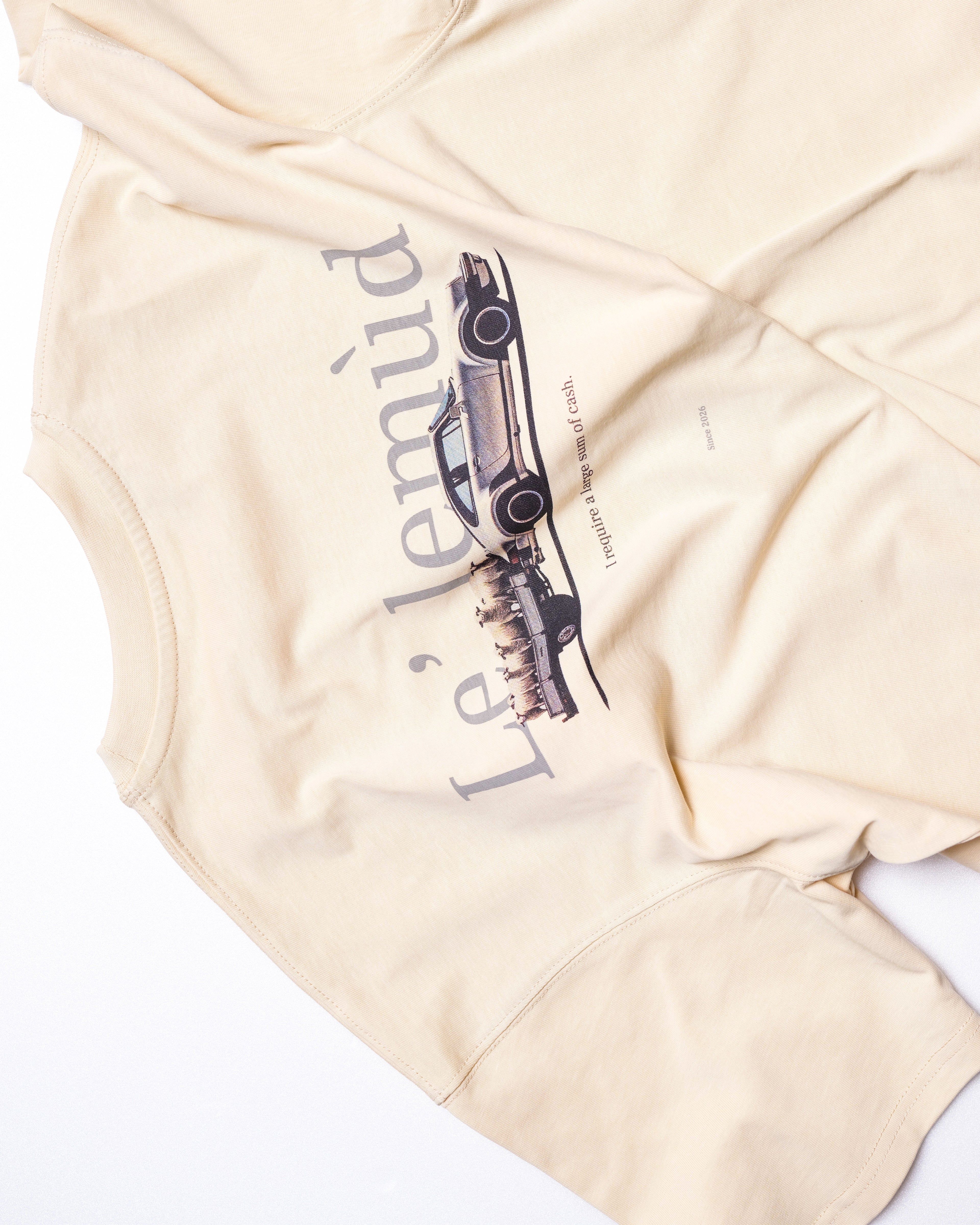 Detail shot of Lelemud back graphic print featuring vintage car design on cream cotton tee